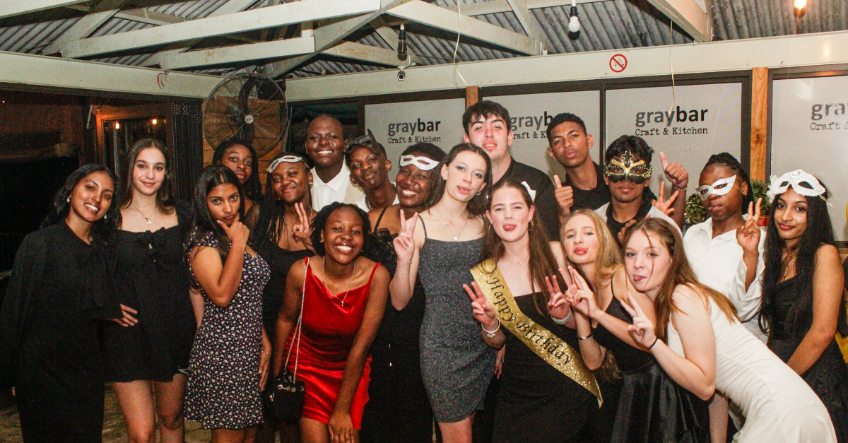 Lively celebration with guests dancing and mingling at a Modderfontein Golf Club event venue